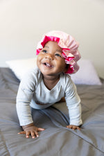 Load image into Gallery viewer, Baby girl wearing a bonnet
