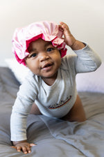 Load image into Gallery viewer, Baby playing with bonnet
